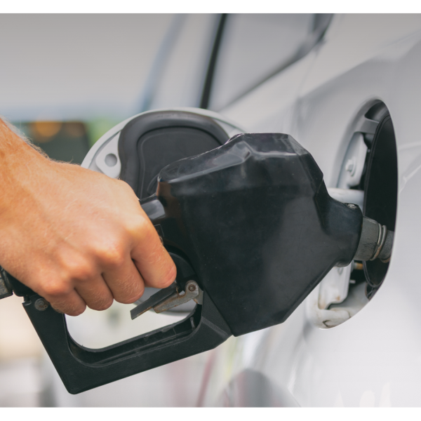 A person filling gas in their car at the gas station