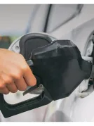 A person filling gas in their car at the gas station