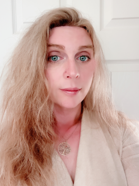 Jenna Brookfield, Worker Representative, photographed in front of a white wall.